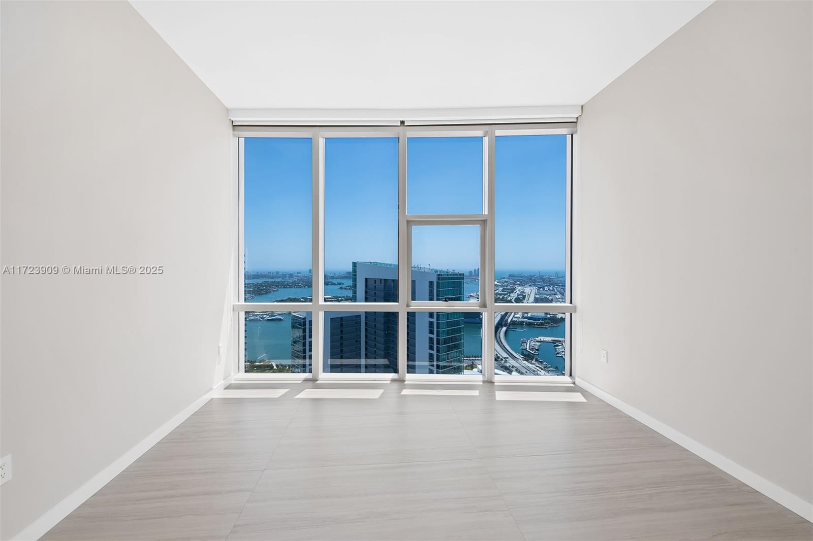 851 Northeast 1st Avenue, Unit PH5411 Miami, FL 33132 - Photo 29 of 40 an empty room with window