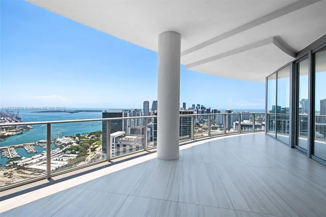 a view of a balcony with chair and chairs