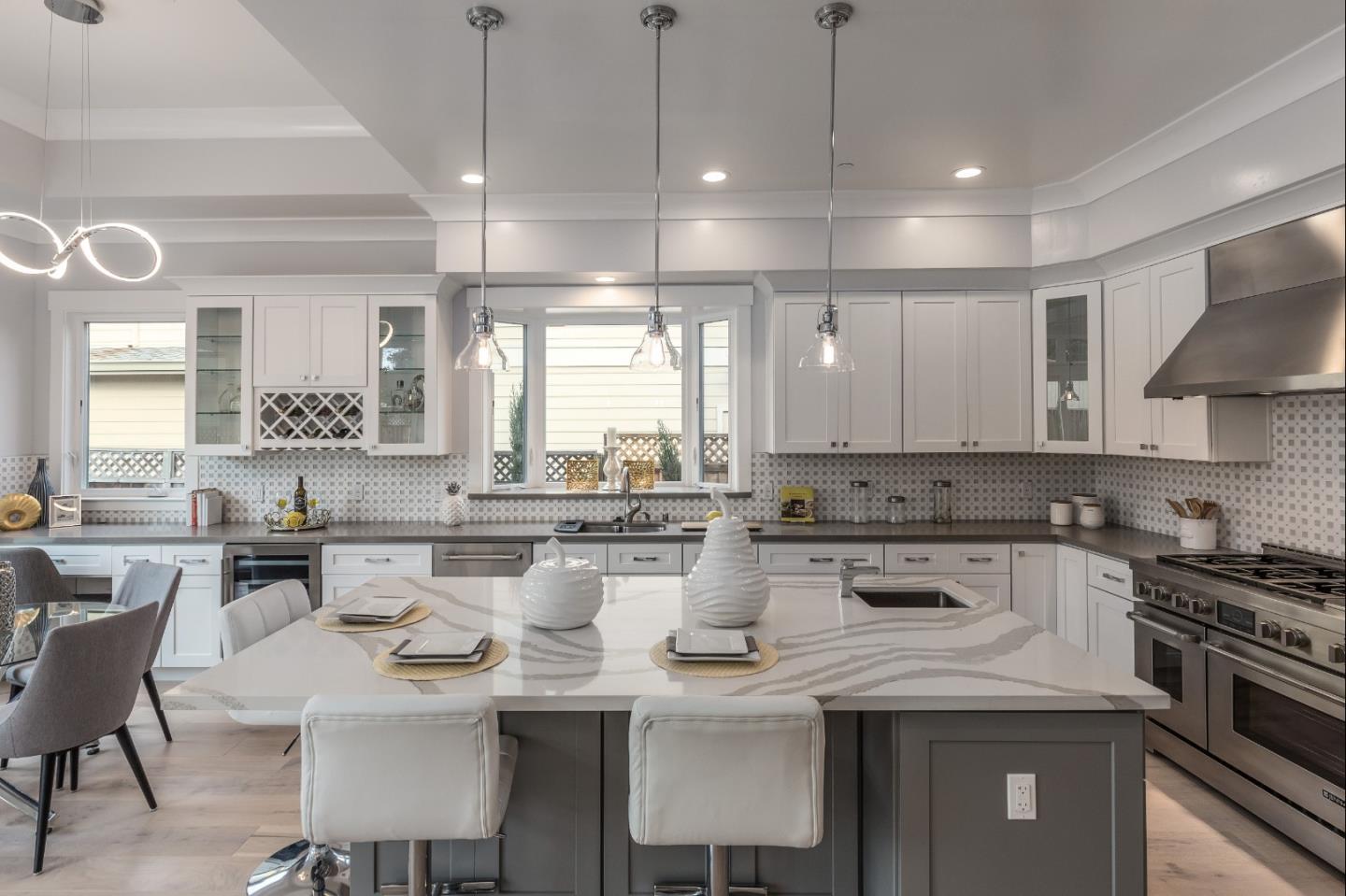 1639 Walters Avenue Campbell, CA 95008 - Photo 15 of 30 a kitchen with a stove a sink a dining table and chairs