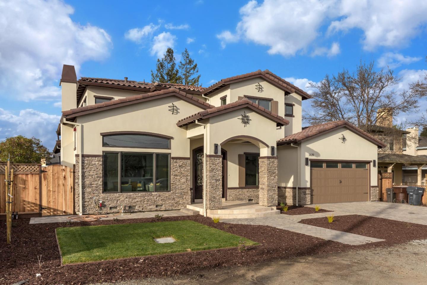 1639 Walters Avenue Campbell, CA 95008 - Photo 2 of 30 a view of a white house with a large windows and a yard with plants and large tree