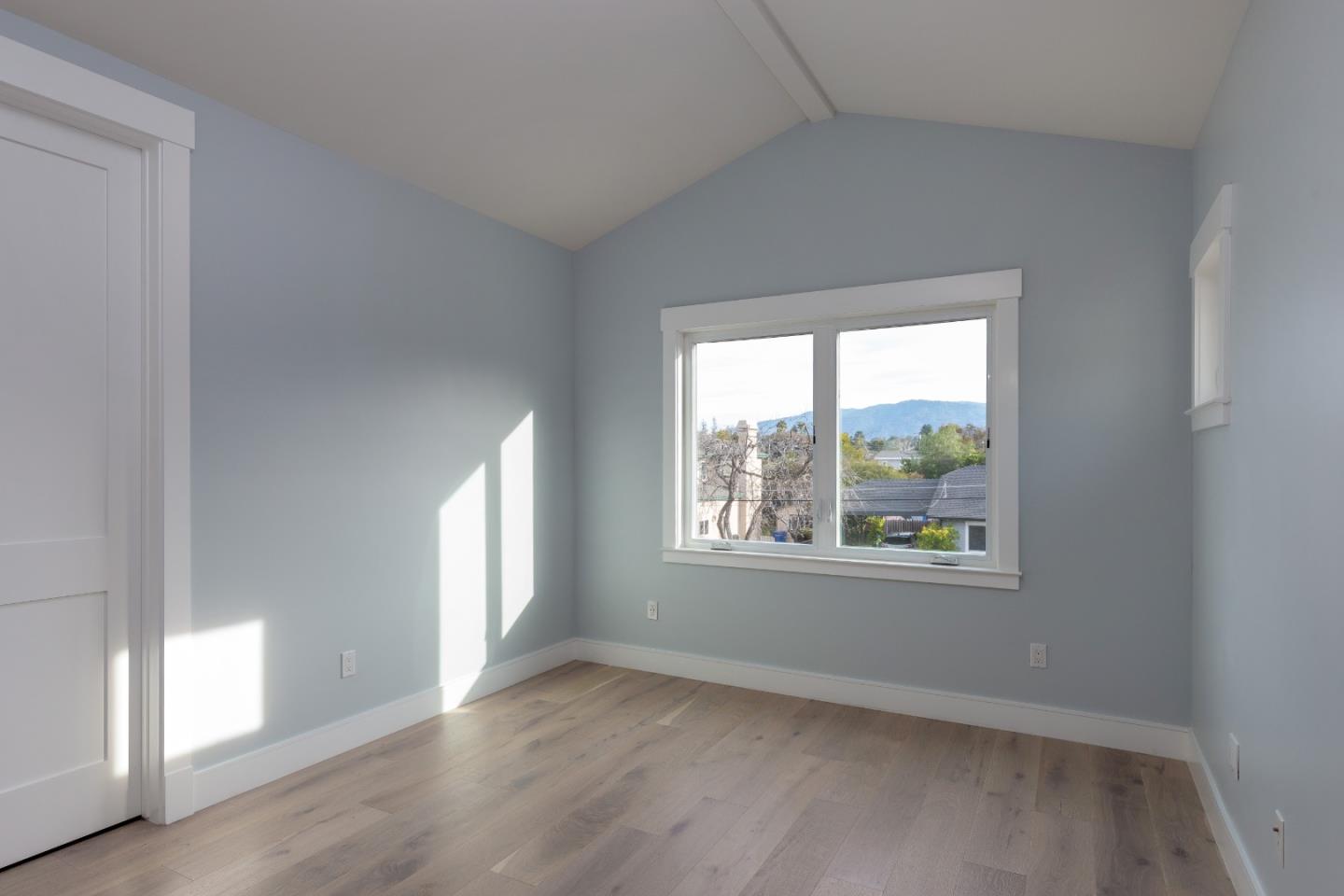 1639 Walters Avenue Campbell, CA 95008 - Photo 21 of 30 an empty room with wooden floor and windows
