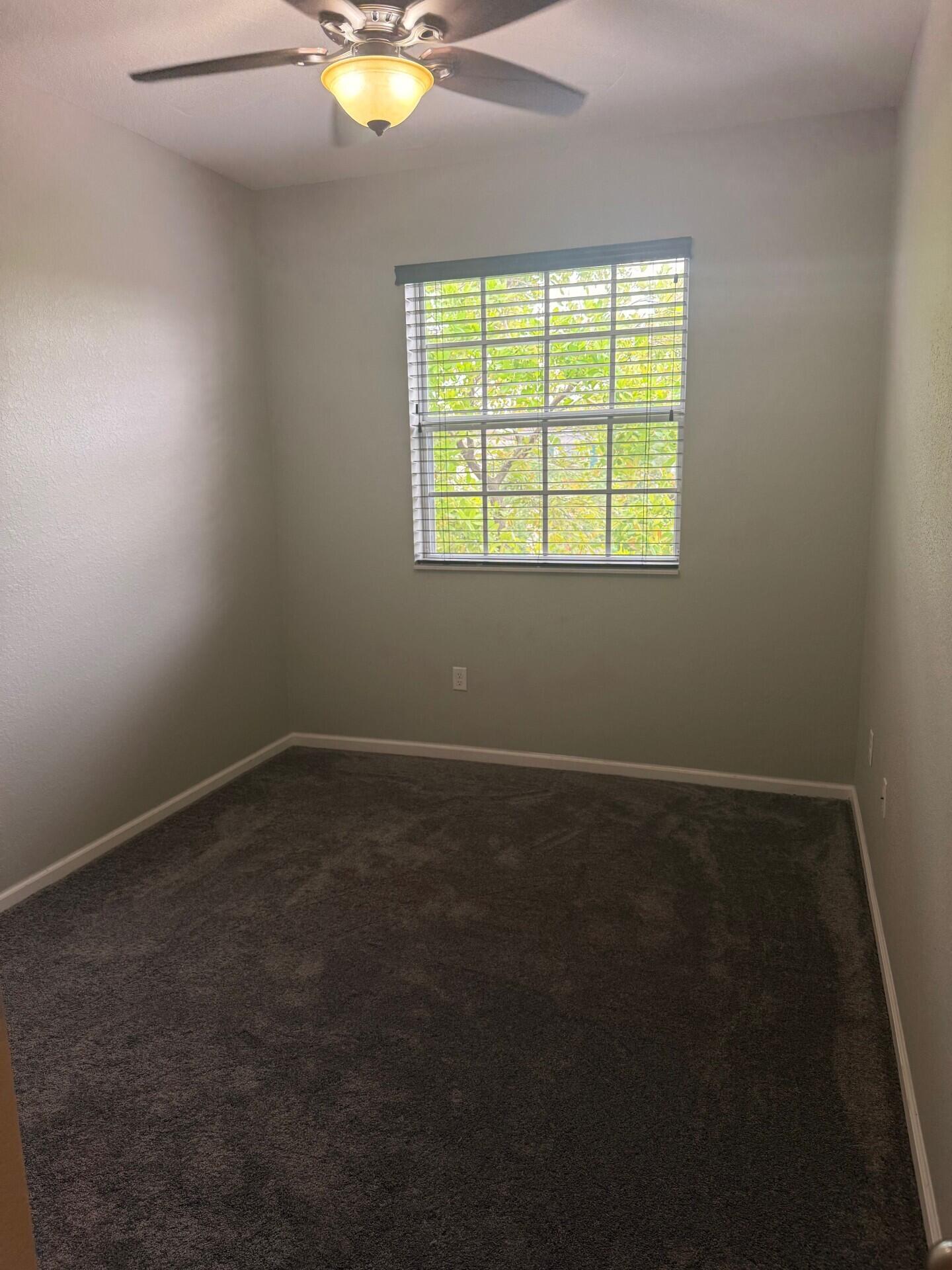 704 Southwest 2nd Way Pompano Beach, FL 33060 - Photo 17 of 22 an empty room with a window