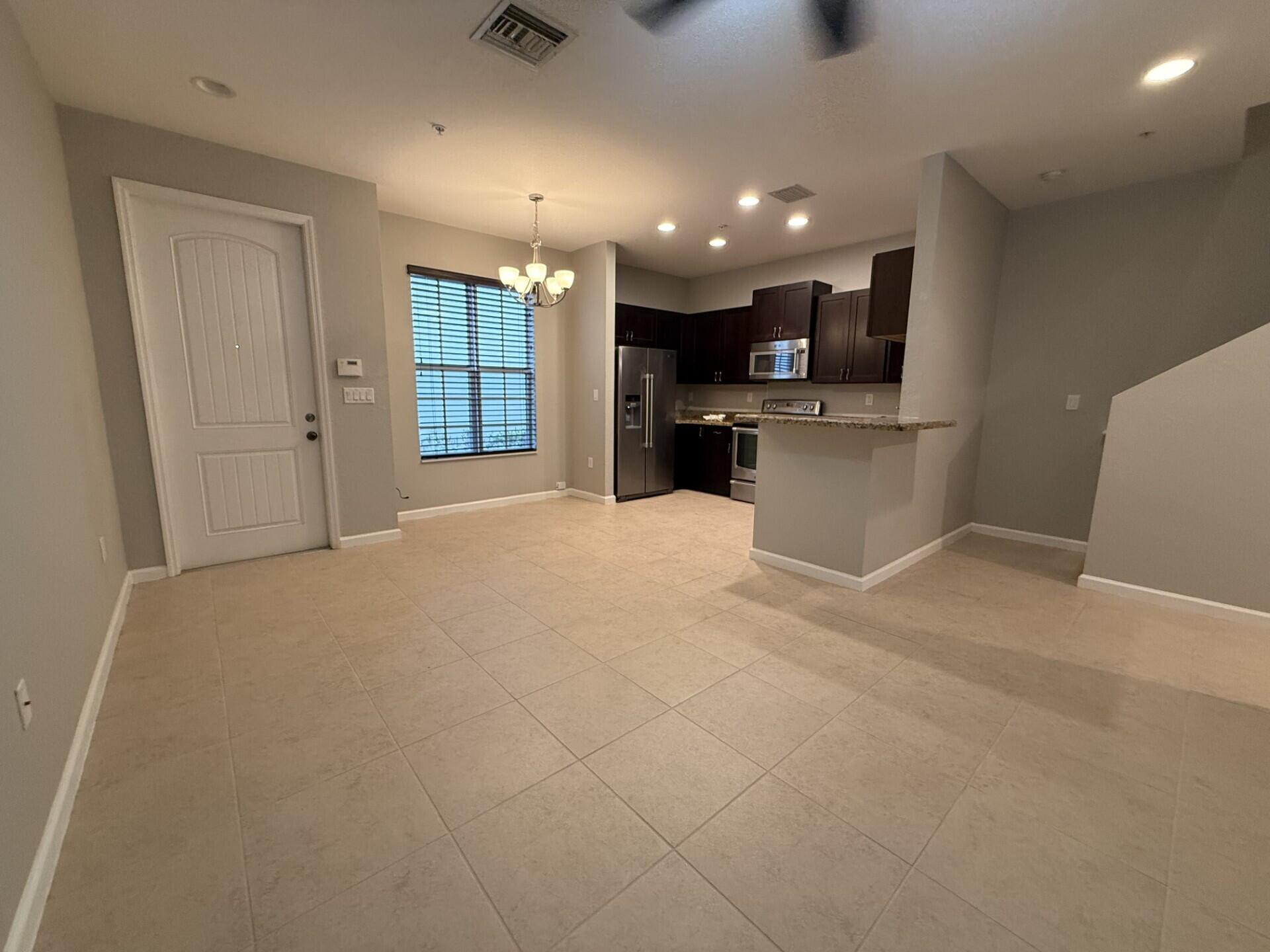 704 Southwest 2nd Way Pompano Beach, FL 33060 - Photo 2 of 22 a view of kitchen with kitchen island and stainless steel appliances