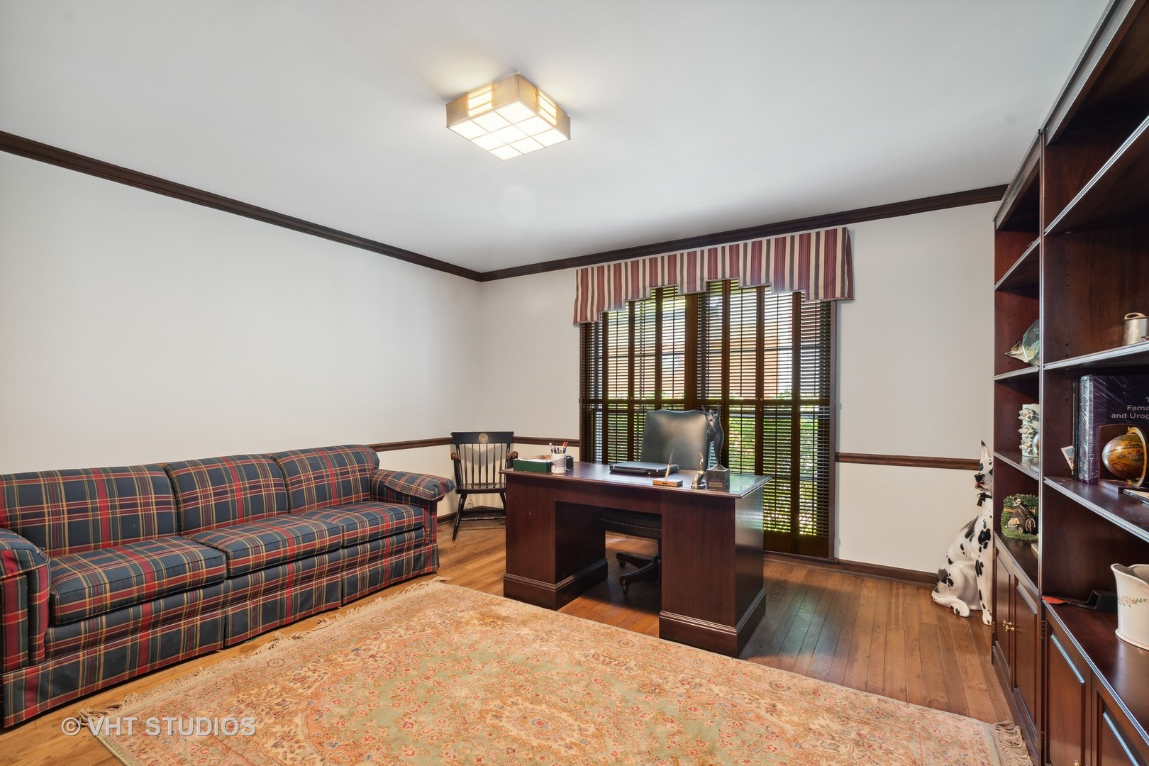 340 Ridge Avenue Winnetka, IL 60093 - Photo 13 of 29 a living room with furniture a flat screen tv and a floor to ceiling window