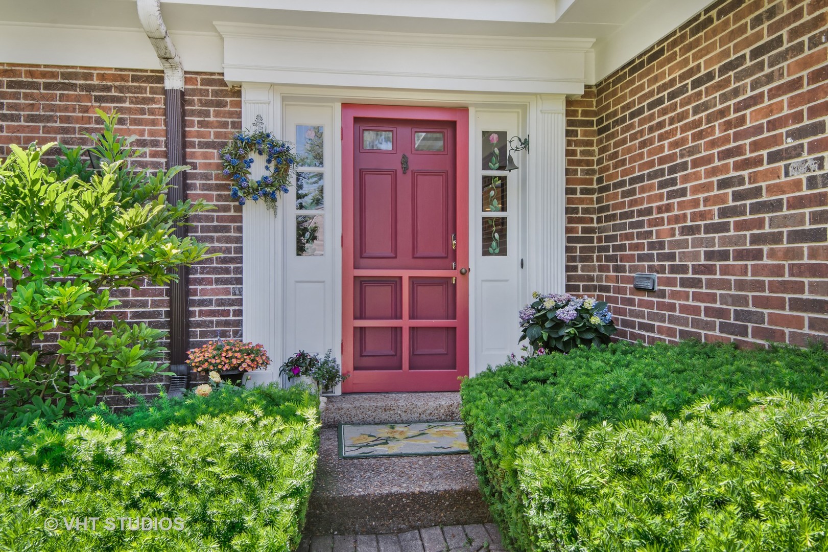 340 Ridge Avenue Winnetka, IL 60093 - Photo 2 of 29 a view of a pathway with plants in front of door