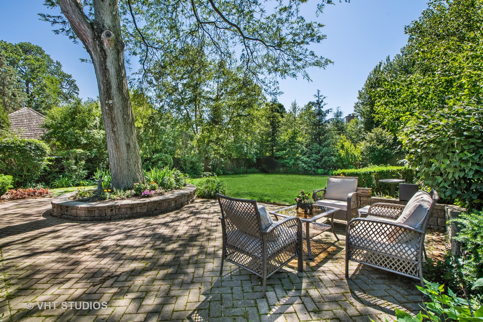 340 Ridge Avenue Winnetka, IL 60093 - Photo 21 of 29 a view of backyard with seating space and trees