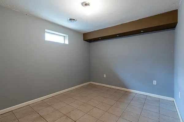 a view of an empty room with racks on the wall