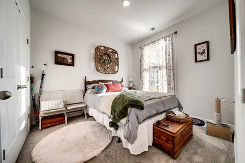 a bed room with a bed and a couch