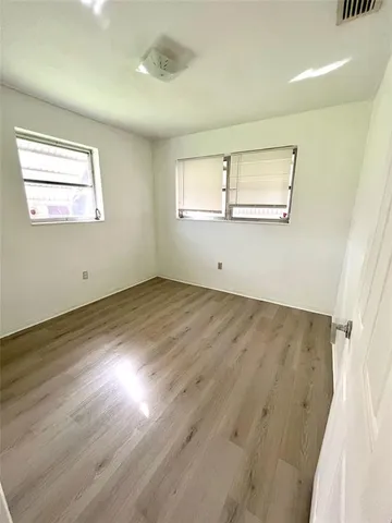 a view of a livingroom with a ceiling fan and window