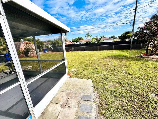 a kitchen with wooden cabinets and a sink
