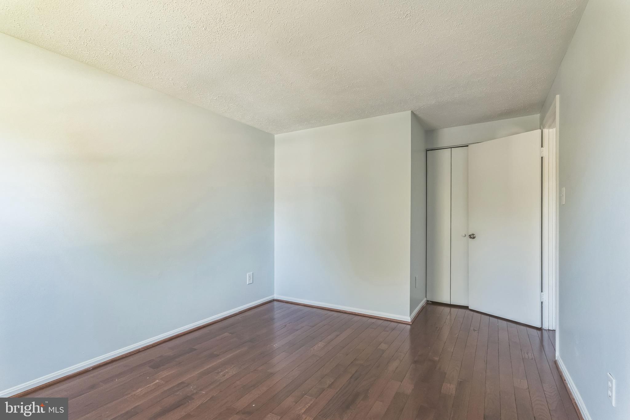 13106 North Point Lane Laurel, MD 20708 - Photo 15 of 30 a view of an empty room with wooden floor