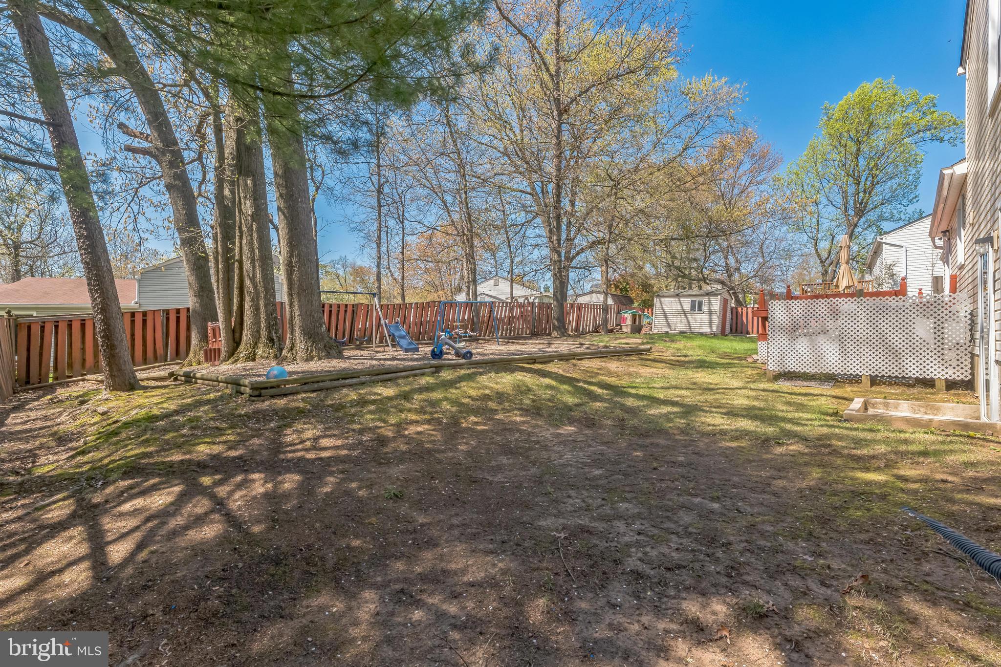 13106 North Point Lane Laurel, MD 20708 - Photo 28 of 30 a backyard of a house with lots of green space