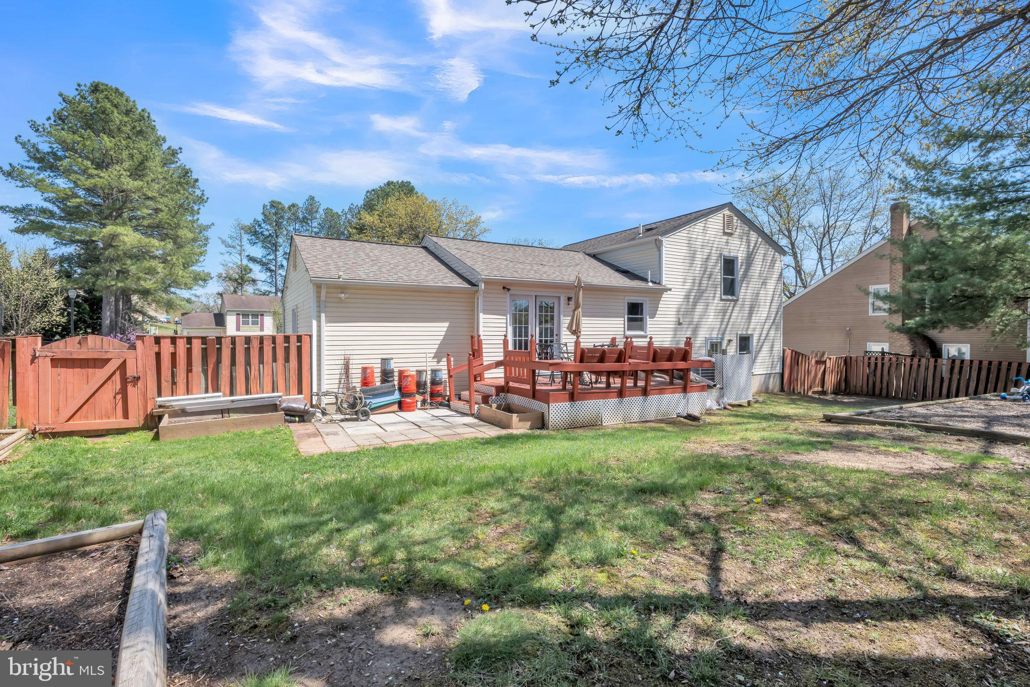13106 North Point Lane Laurel, MD 20708 - Photo 30 of 30 a view of a house with a yard porch and furniture