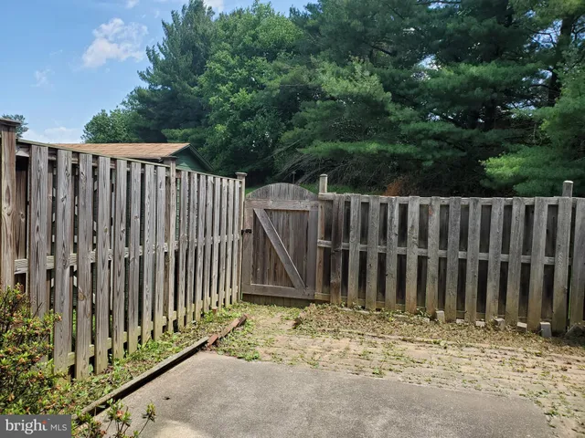 a view of a house with backyard and a slide