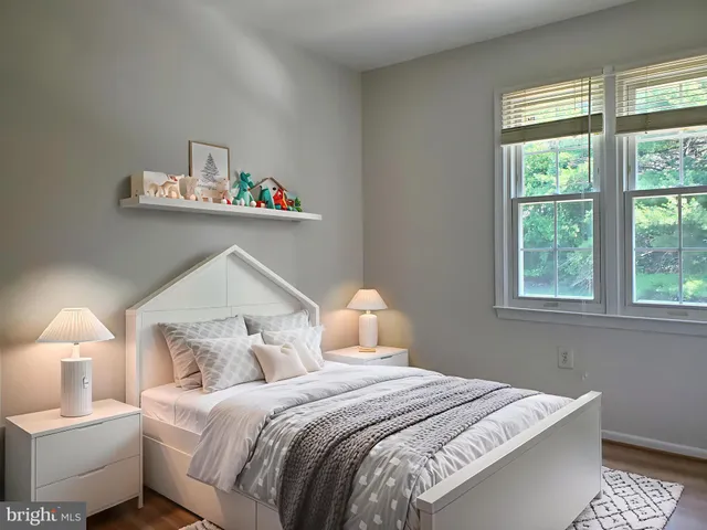 a bedroom with bed and a window