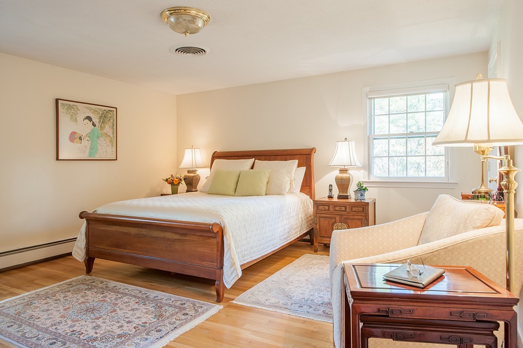 41 Laxfield Road Weston, MA 02493 - Photo 7 of 11 a bedroom with furniture and wooden floor