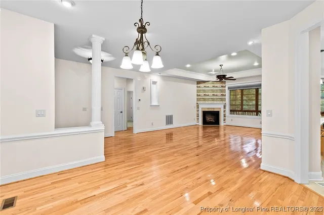 a view of a livingroom with a furniture wooden floor and window