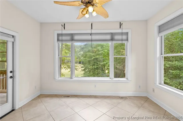 a spacious bathroom with a tub shower and sink