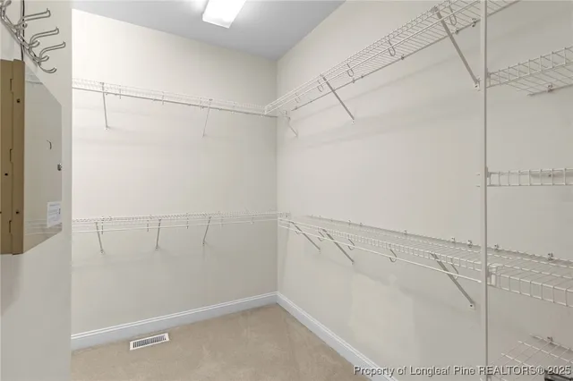 a bathroom with a double vanity sink mirror and