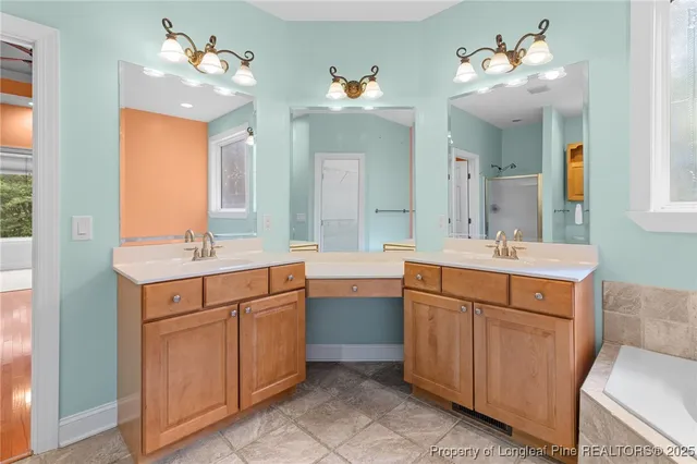 an empty room with ceiling fan and window