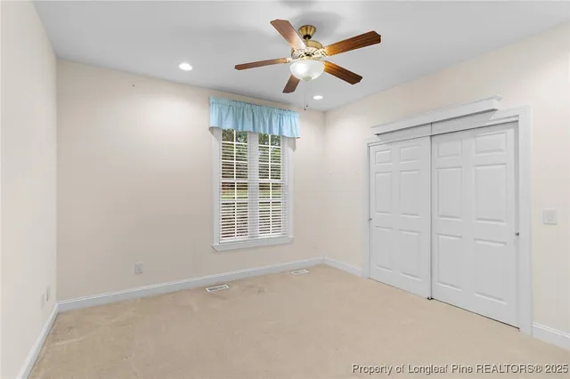 a bathroom with a double vanity sink toilet mirror and bathtub