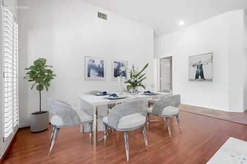 a kitchen with stainless steel appliances a sink stove and a window