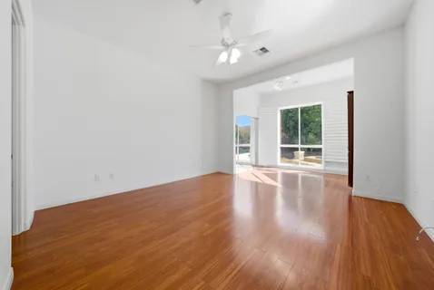 a spacious bathroom with a sink and a mirror