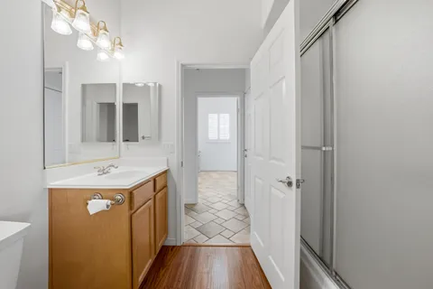 an aerial view of a house with a yard and potted plants