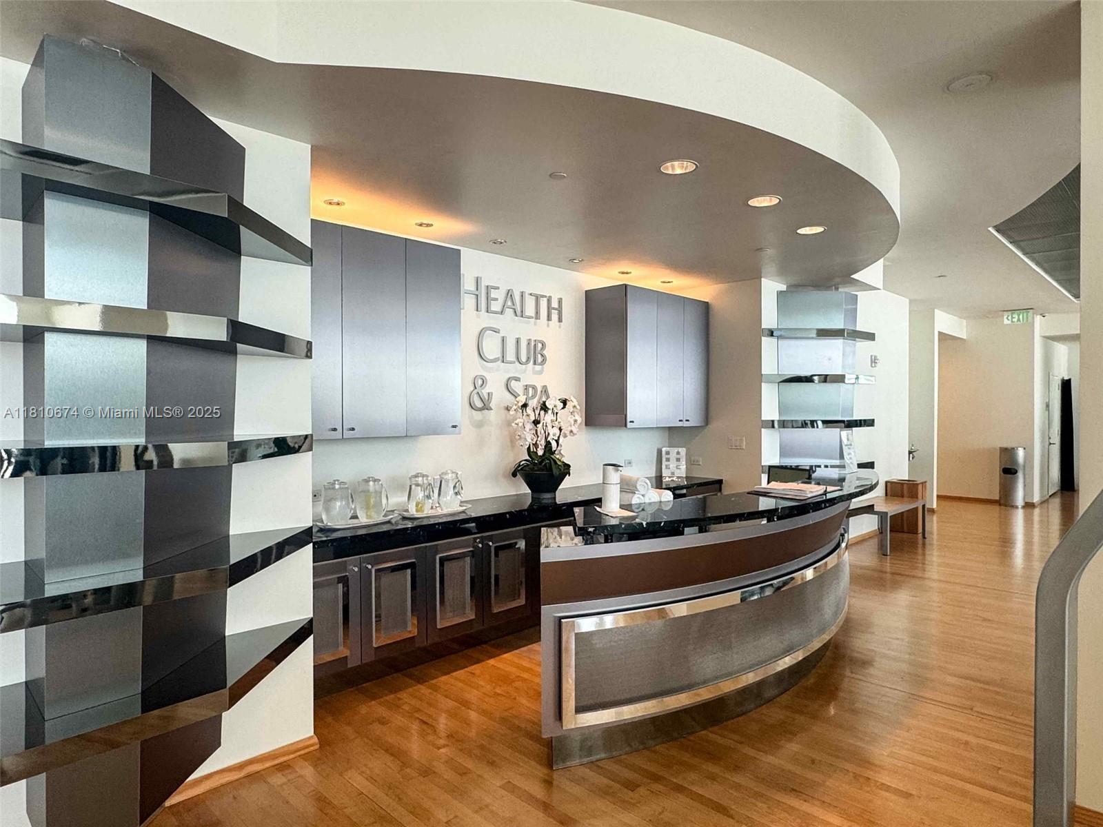 1331 Brickell Bay Drive, Unit 1504 Miami, FL 33131 - Photo 19 of 30 a kitchen with counter top space cabinets and stainless steel appliances