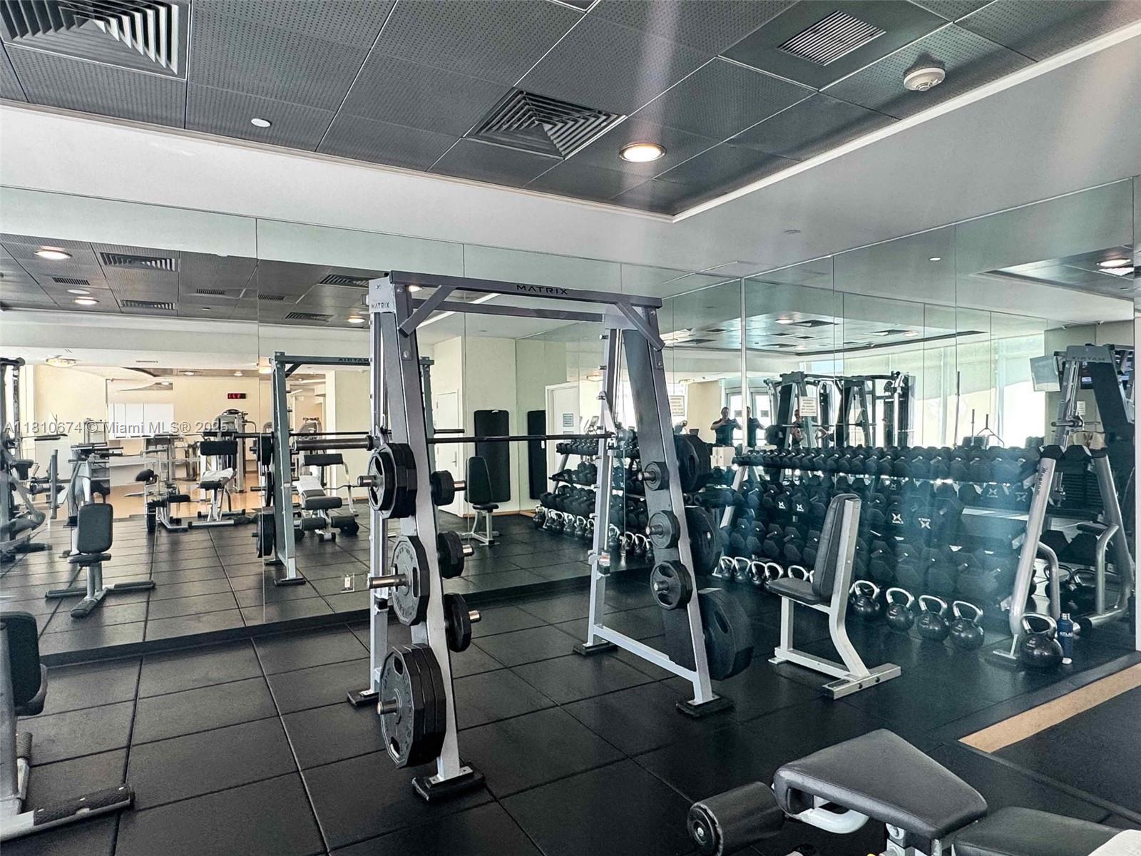 1331 Brickell Bay Drive, Unit 1504 Miami, FL 33131 - Photo 20 of 30 a gym room with lots of gym equipment
