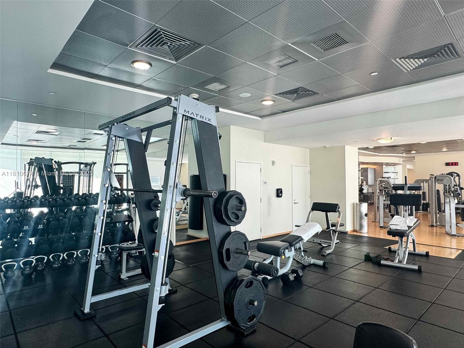 1331 Brickell Bay Drive, Unit 1504 Miami, FL 33131 - Photo 21 of 30 a room with gym equipment