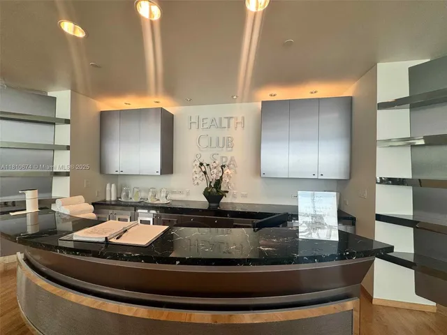 a kitchen with a appliances and cabinets