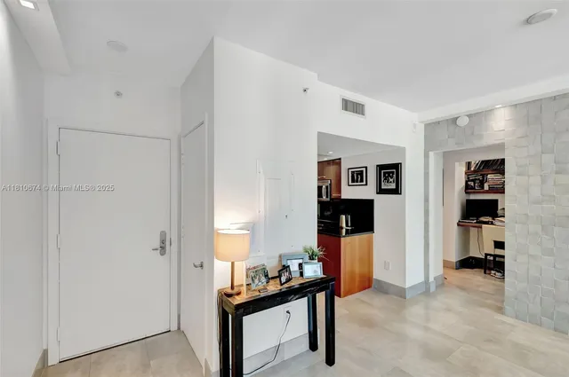 a view of a livingroom with furniture and gym equipment