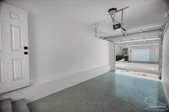 a view of a livingroom with wooden floor and a ceiling fan