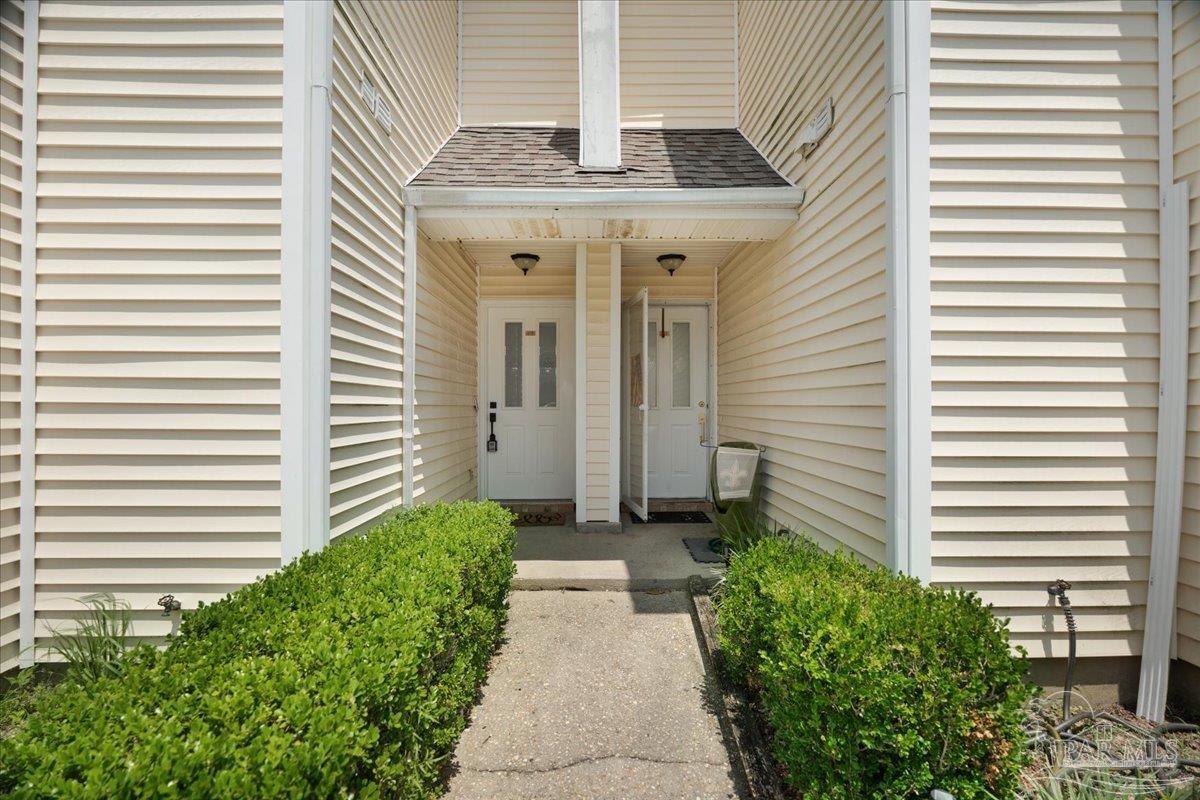 601 East Burgess Road, Unit J2 Pensacola, FL 32504 - Photo 12 of 38 a view of a pathway with a house