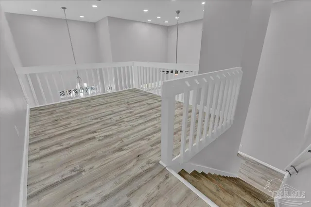 a view of a hallway with stairs