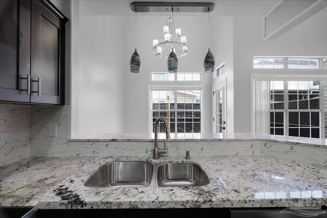 a kitchen with granite countertop a sink and a granite counter tops