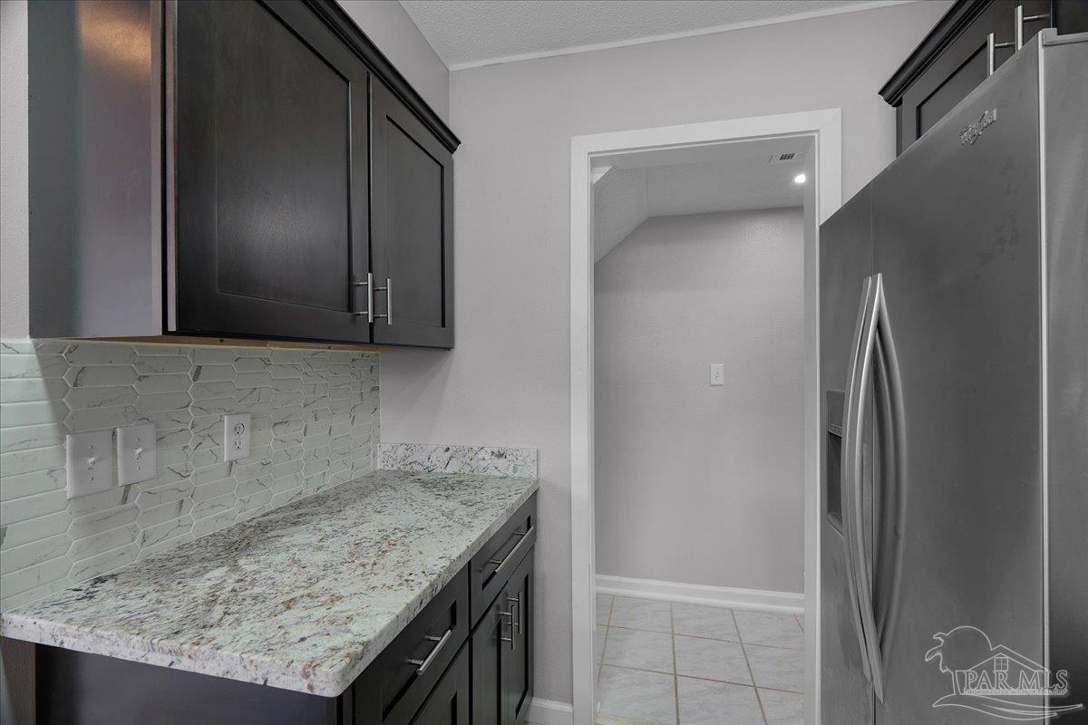 601 East Burgess Road, Unit J2 Pensacola, FL 32504 - Photo 33 of 38 a bathroom with a granite countertop sink and a mirror
