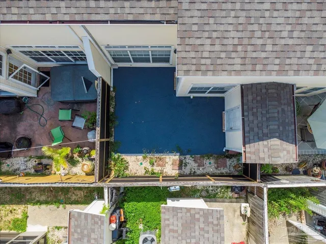 a view of a house with a yard and sitting area