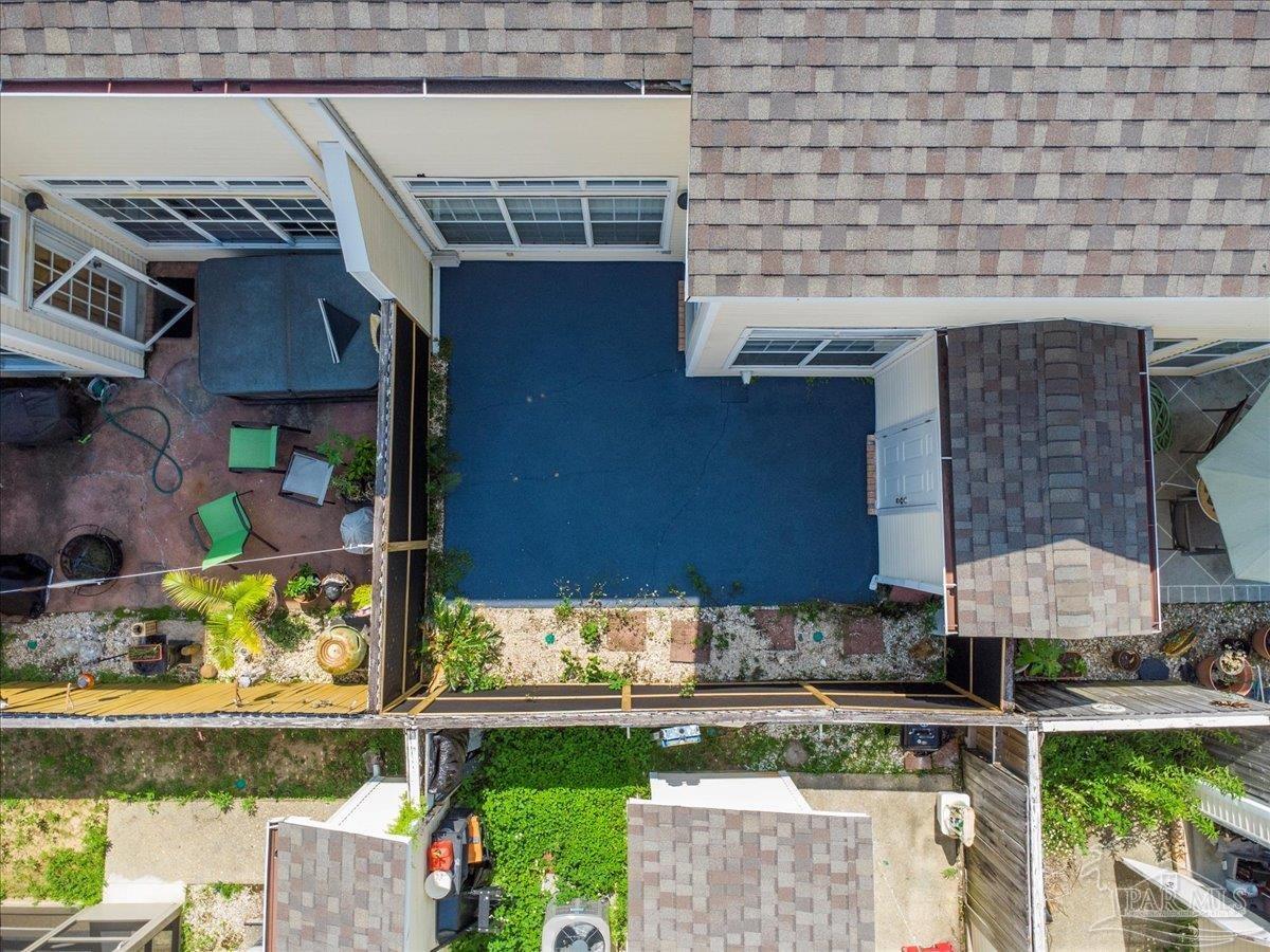 601 East Burgess Road, Unit J2 Pensacola, FL 32504 - Photo 37 of 38 a view of a house with a yard and sitting area