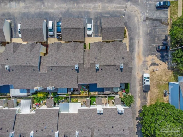 an aerial view of a house with yard
