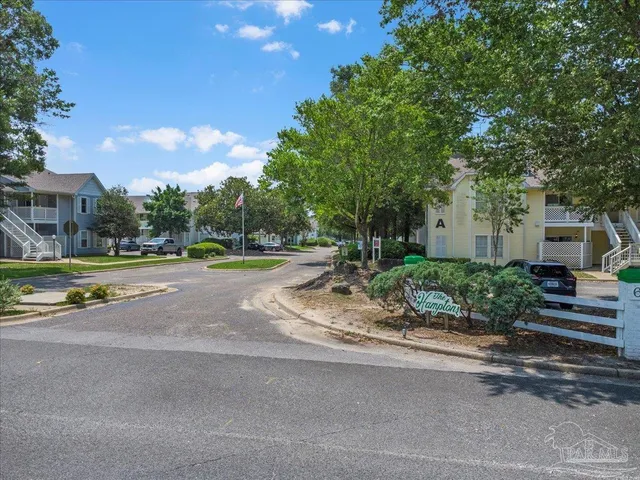a view of street with houses and trees