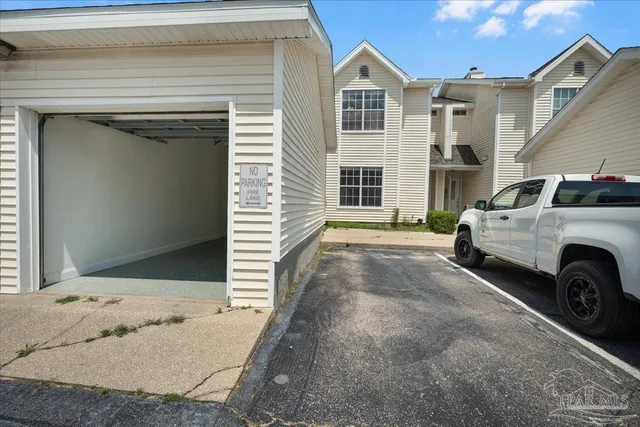 a view of a car in front of a house