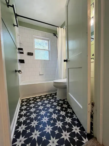 a bathroom with a sink and a shower