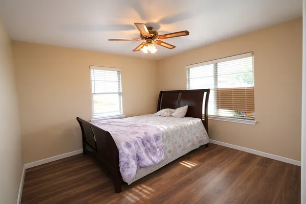 a bedroom with a bed and window