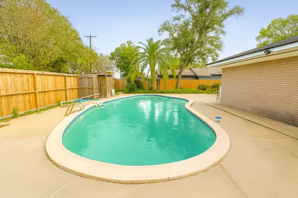 a small pool with a view of roof