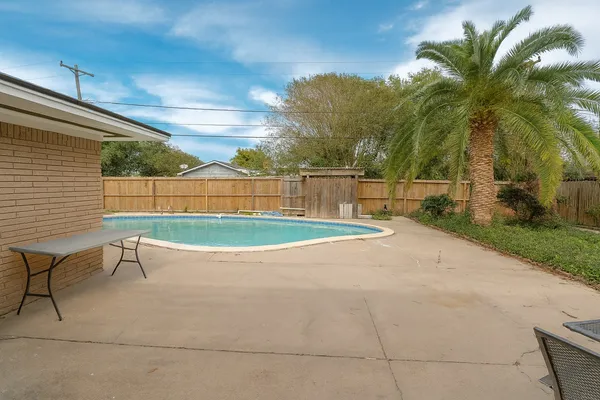 a view of a backyard with a patio