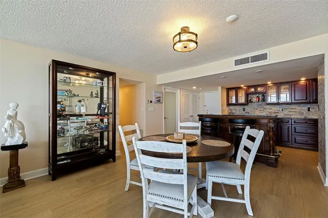 a view of a dining room with furniture and a livingroom