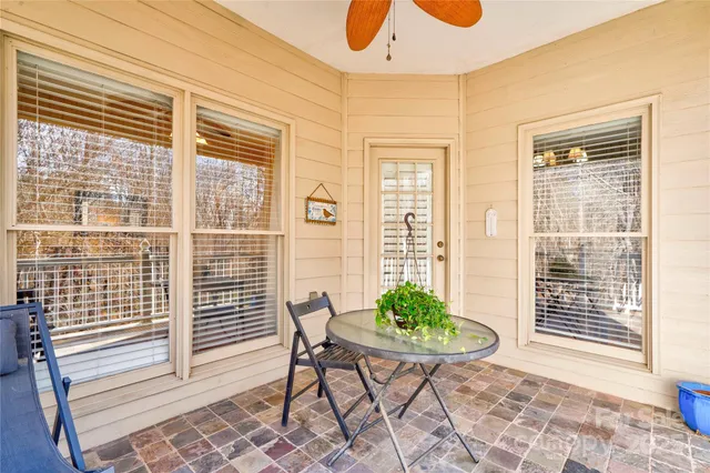 a view of a dining room with furniture and a window