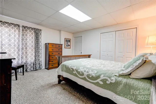 a bedroom with a bed and a table in it